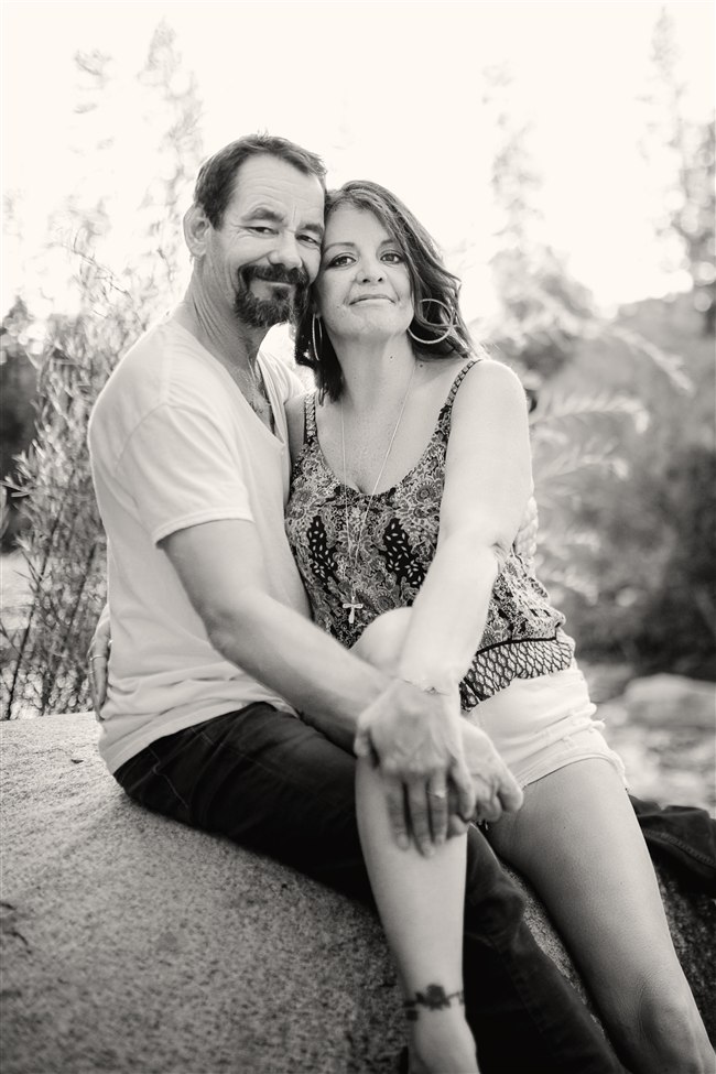 A black-and-white portrait of the couple together
